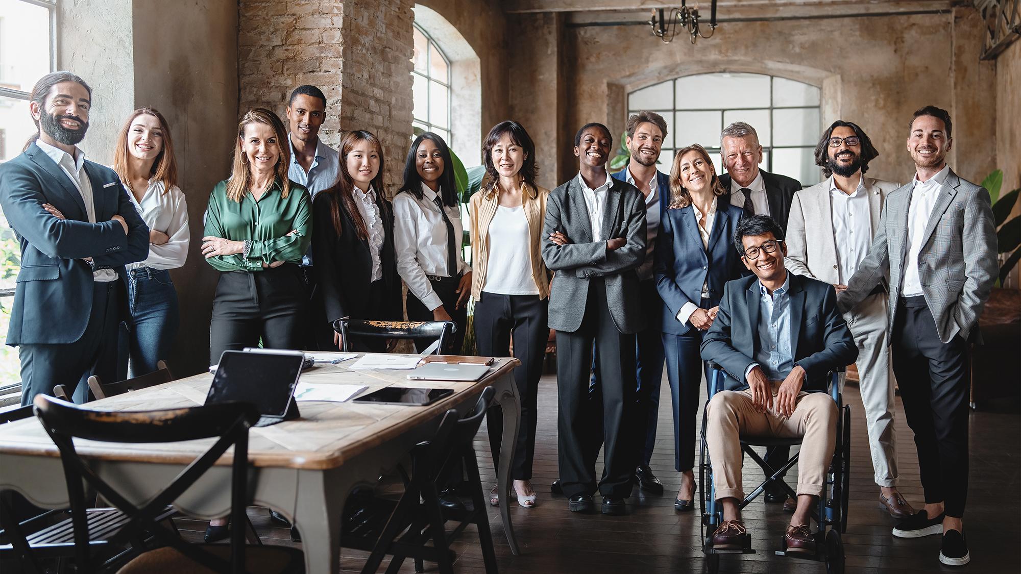 group of colleagues posing in an office