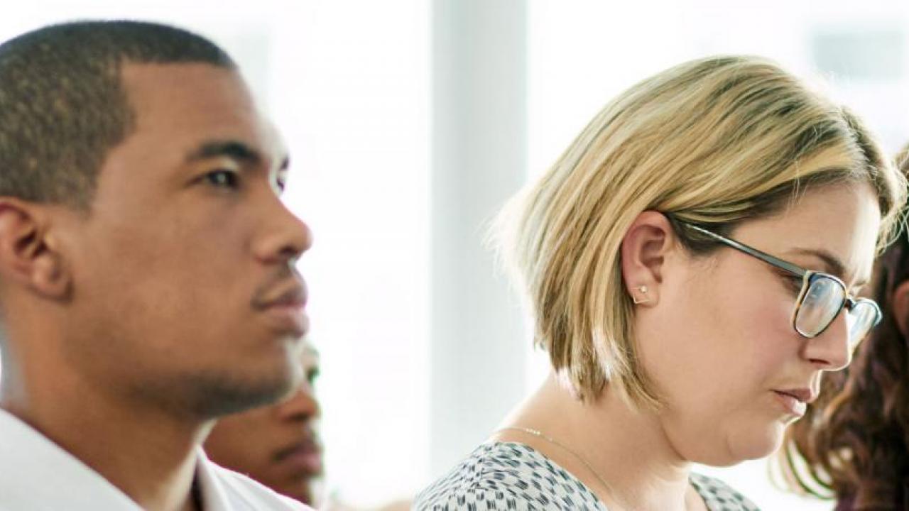 people listening to business presentation