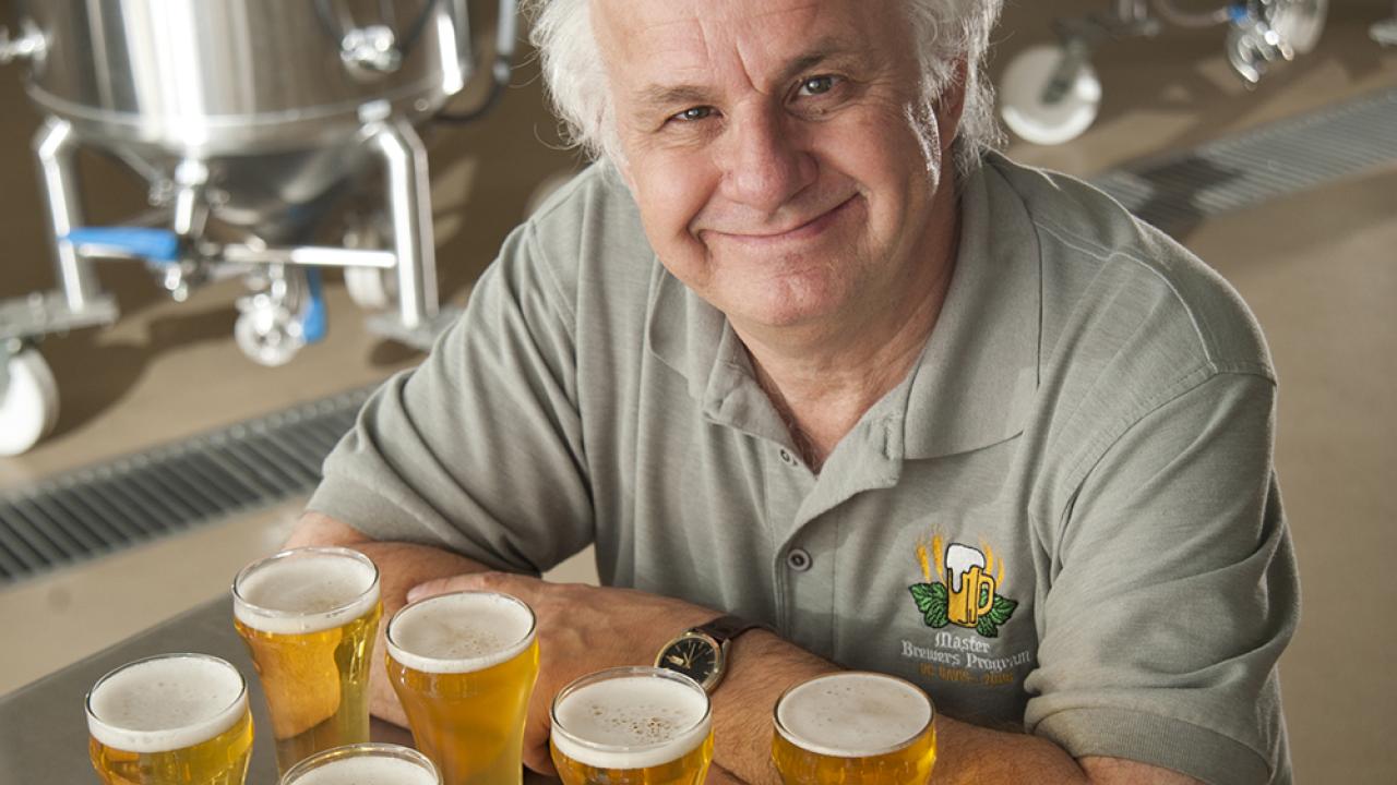online beer quality instructor Charlie Bamforth in front of beer glasses