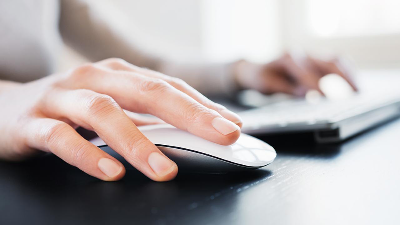 closeup of person clicking on mouse