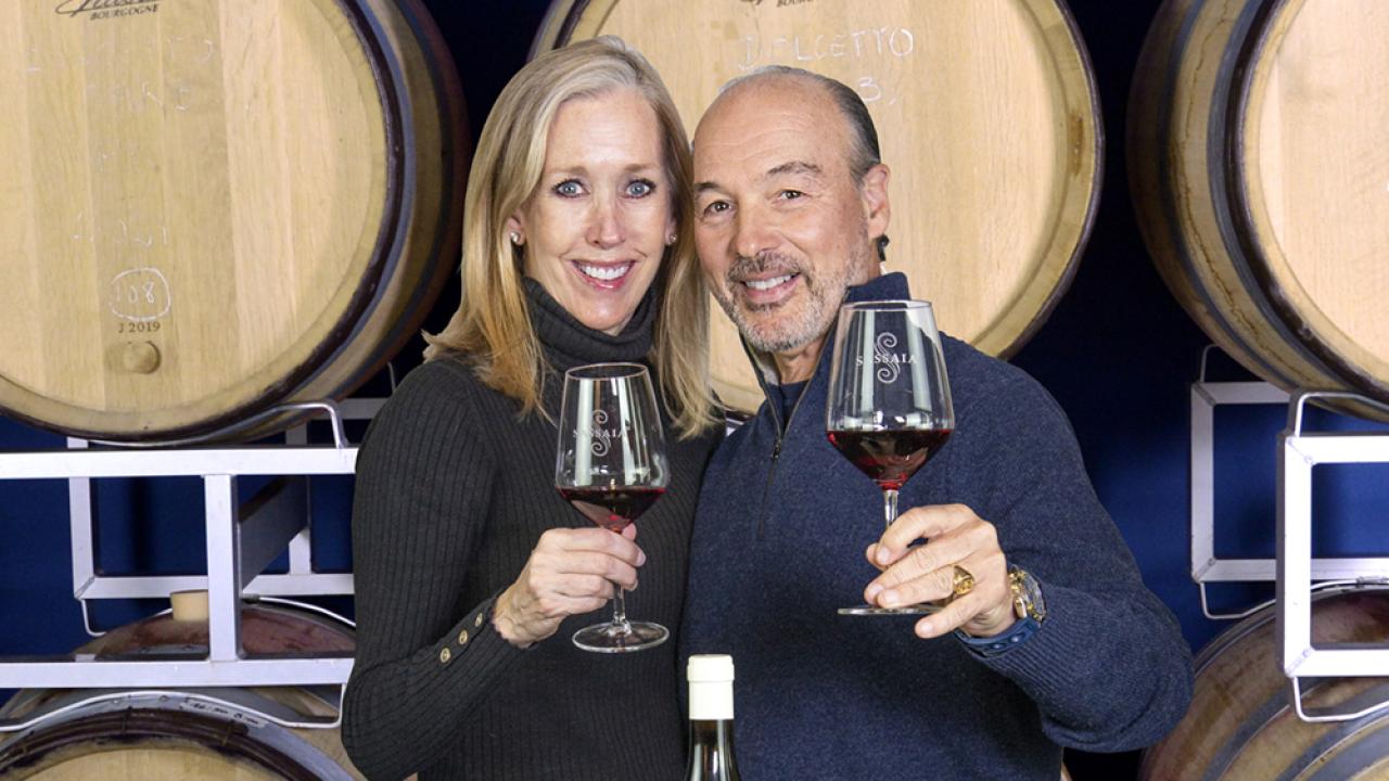 Enrico de Alessandrini and wife with wine