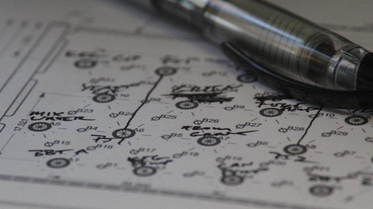 an engineering drawing of a flow panel and a pen