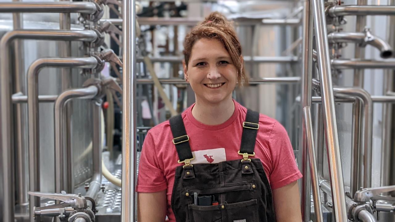 Tapping Potential Scholarship winner Jae Vanderwerf poses in brewery