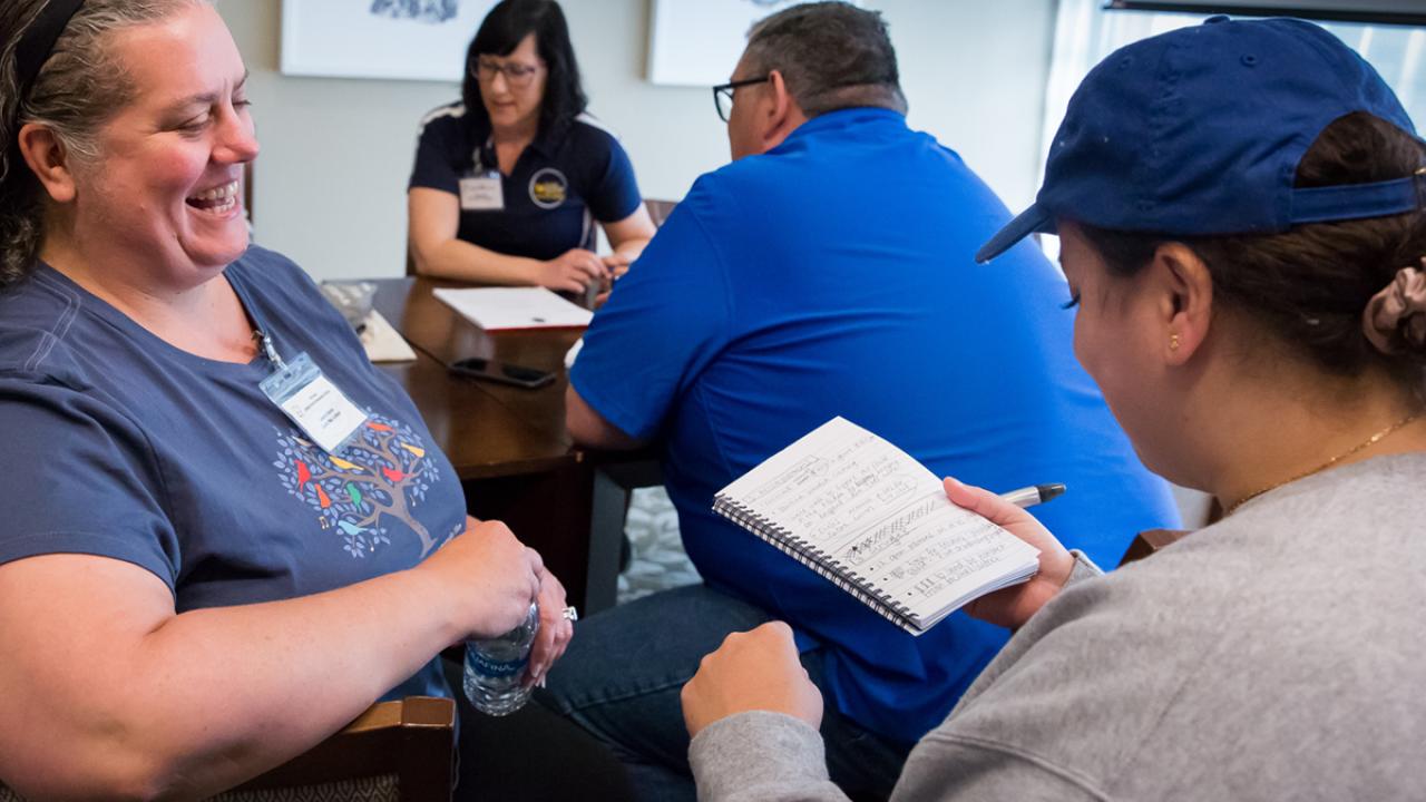 school food professionals engage in conversations during their training event