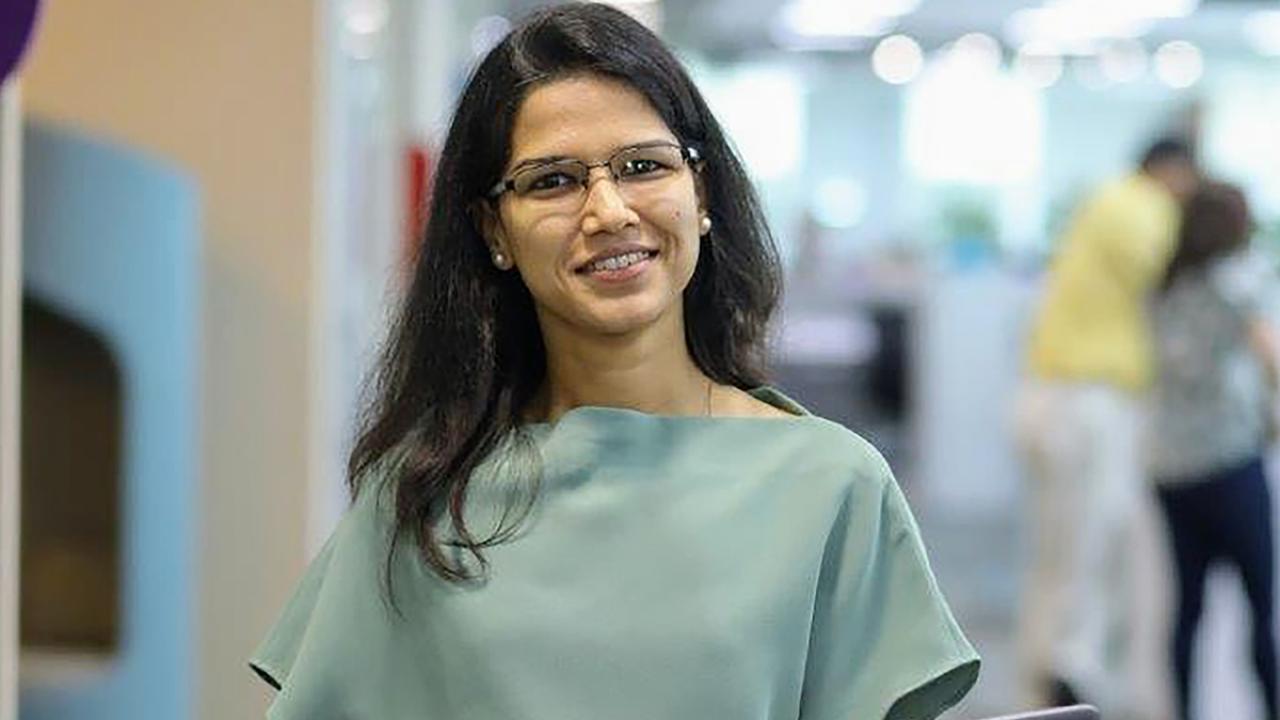 UC Davis Sensory Science and Consumer Testing Certificate Program grad Taruna Sanghi poses in office with laptop
