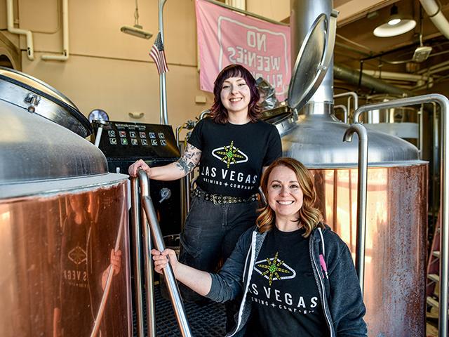 photo of UC Davis Master Brewer grad Amanda Koeller and fellow brewer in Las Vegas brewery