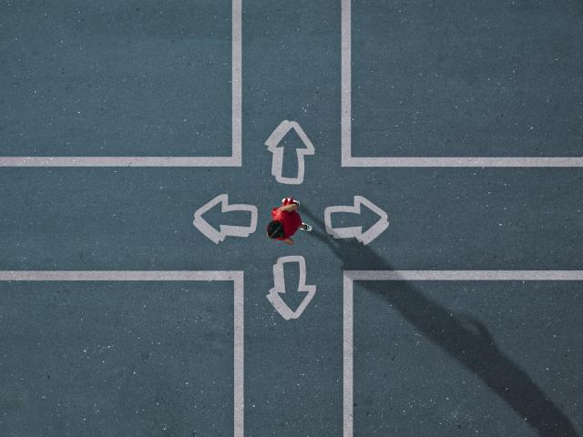 girl choosing direction in painted crossroad