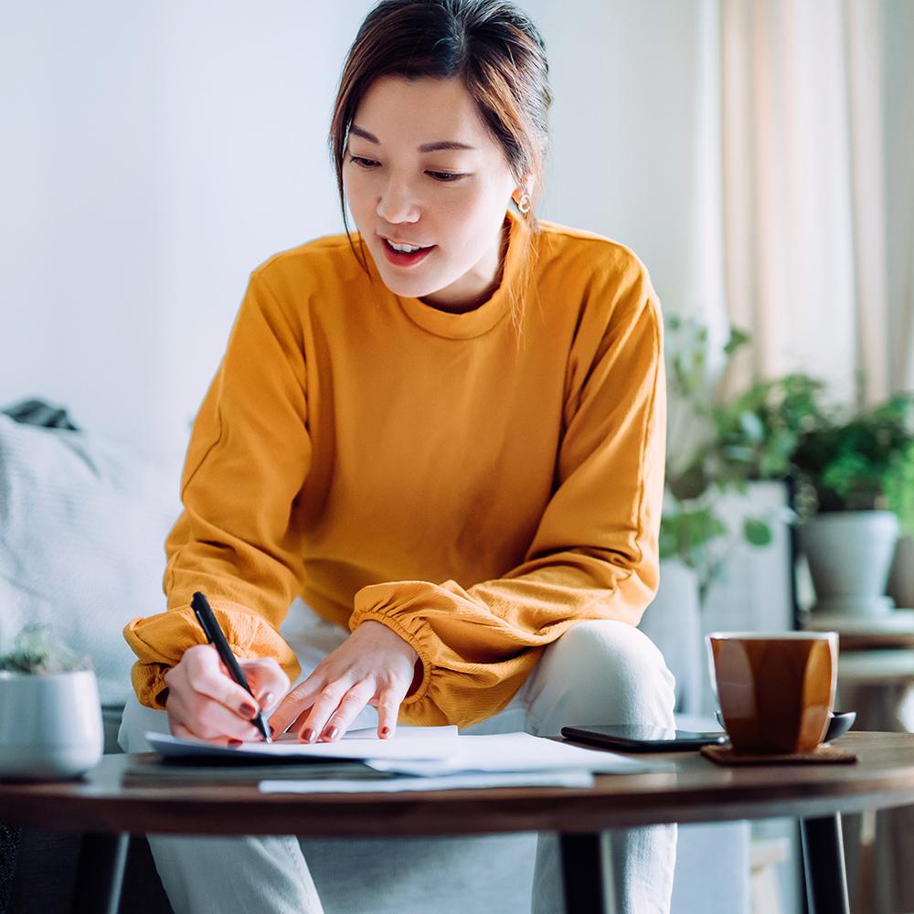 woman taking notes