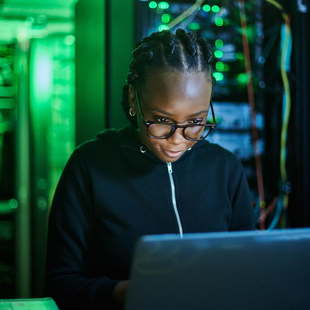 woman programming on a laptop computer