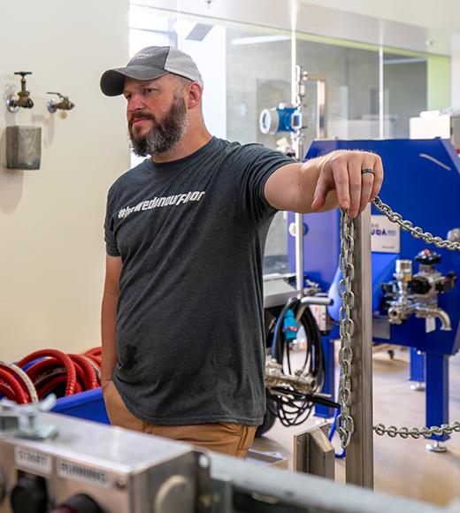 UC Davis online Master Brewers student Greg Dedicke in the UC Davis Pilot Brewery