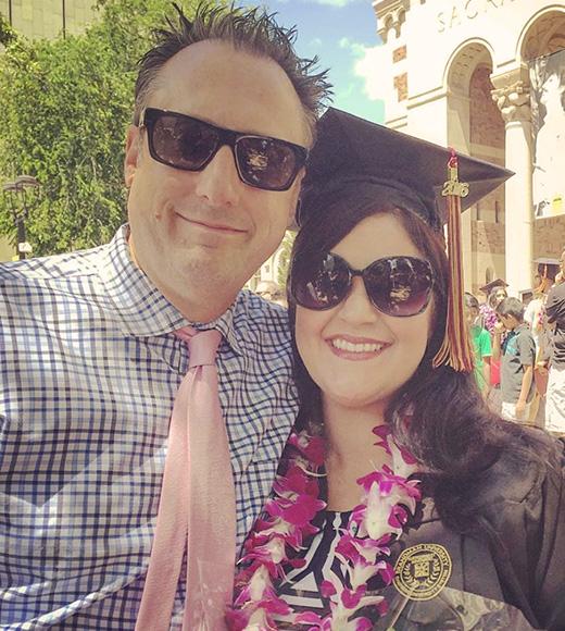 UC Davis CPE accounting program grad Melissa Hall poses with her husband during her undergrad graduation