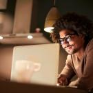 young professional at home on computer