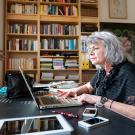 senior woman working on a laptop at a desk