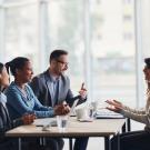 woman sits on an interview panel