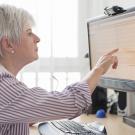 senior women pointing to computer screen