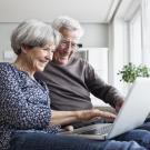 OLLI man and woman watching laptop