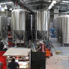 brew tanks and equipment arranged in an orderly manner during the installation phase at Seismic Brewing