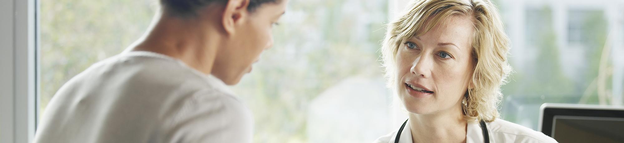 clinician talking to patient